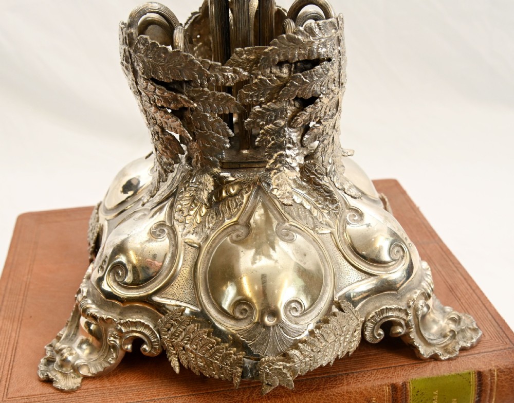 A silver-plated three-light candelabra designed in the shape of a palm tree with detailed foliate leaves and a scrolled base. View XX