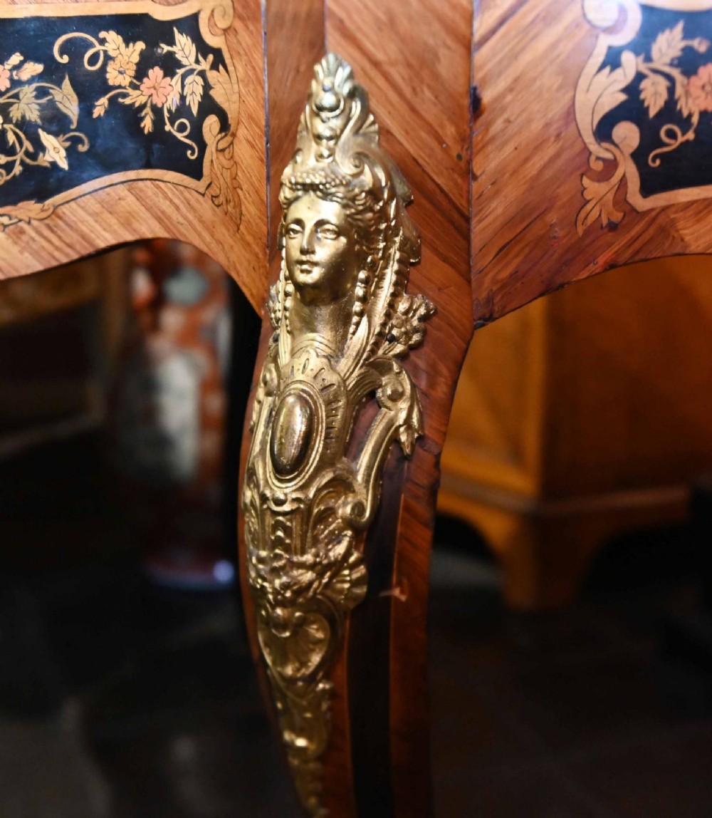 A French Louis XV style centre table featuring intricate floral marquetry, a serpentine top, cabriole legs, and gilded bronze mounts. View XI