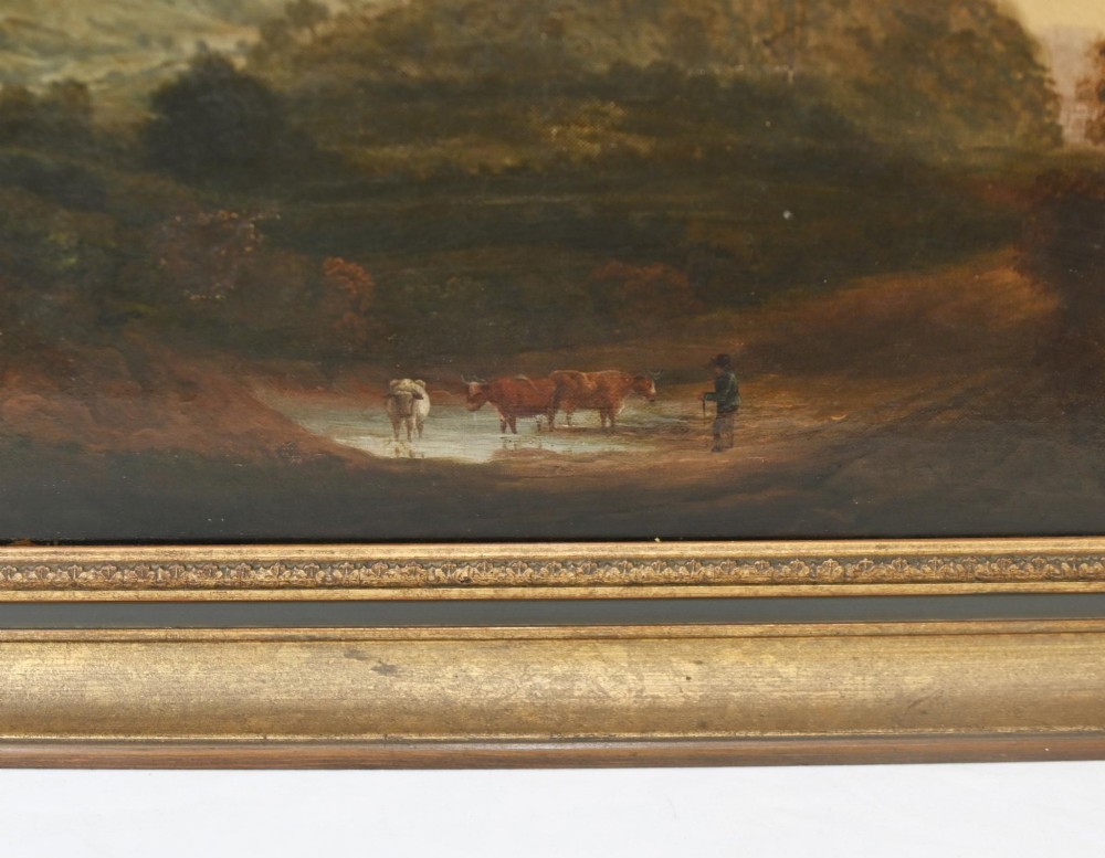 A Victorian oil painting depicting cattle near a stream in a pastoral landscape with hills and castle ruins, housed within a gilt and dark wooden frame. View II
