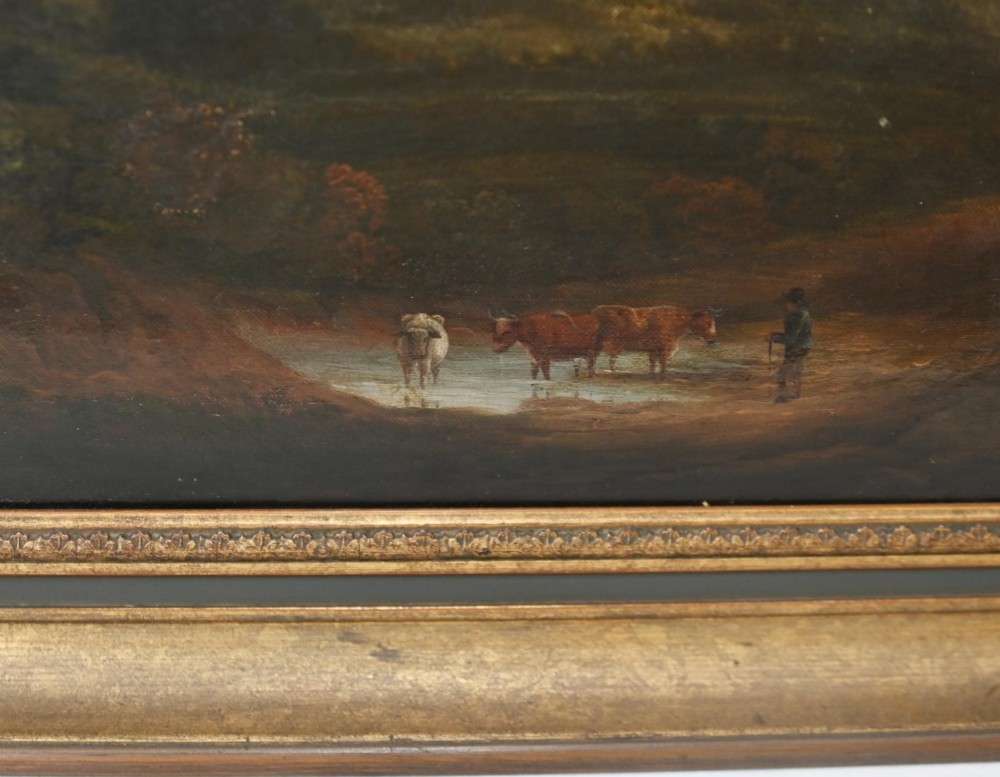 A Victorian oil painting depicting cattle near a stream in a pastoral landscape with hills and castle ruins, housed within a gilt and dark wooden frame. View VII