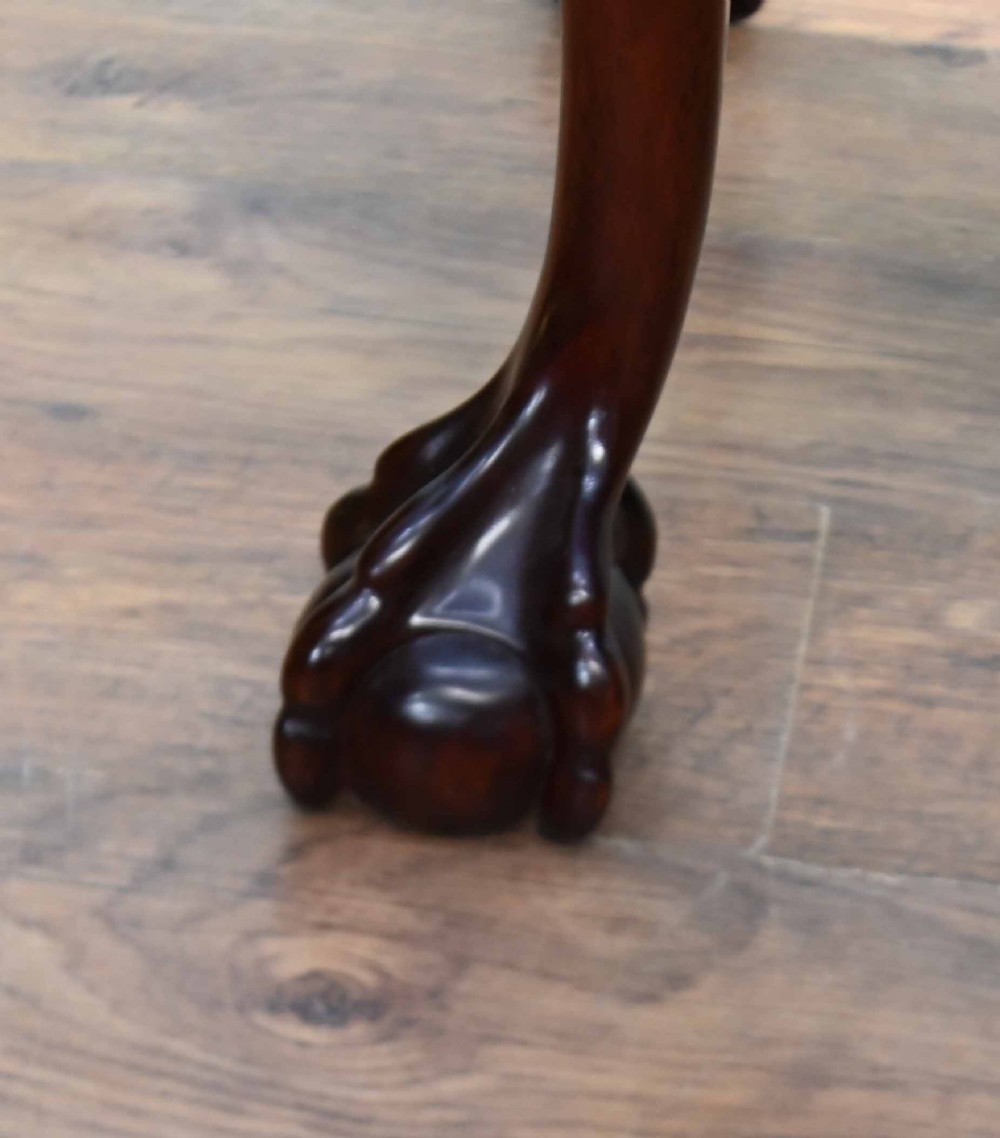 A rectangular Chippendale revival mahogany console table featuring a central carved apron shell detail, cabriole legs, and carved claw and ball feet. View VII