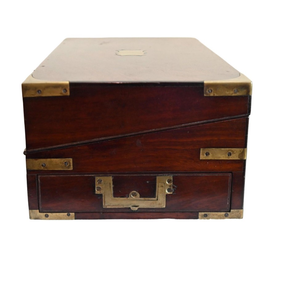 A rectangular warm brown mahogany wooden writing slope box featuring brass corner brackets and a shaped brass keyhole escutcheon. View IV