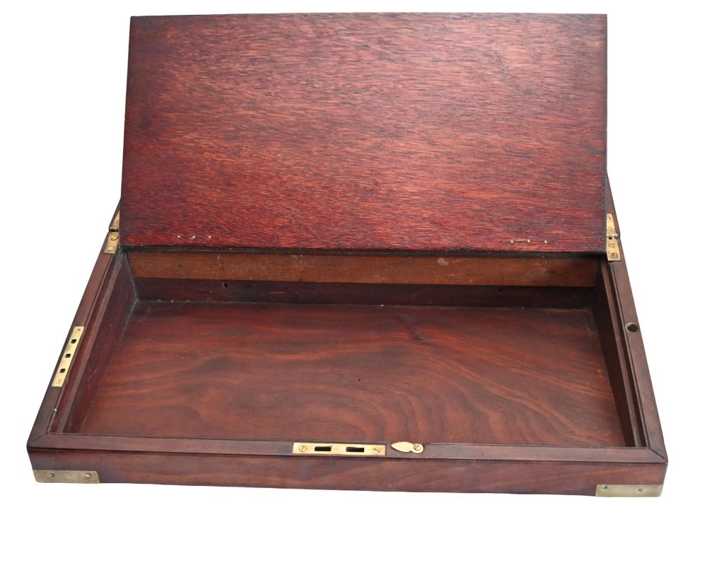 A rectangular warm brown mahogany wooden writing slope box featuring brass corner brackets and a shaped brass keyhole escutcheon. View VII