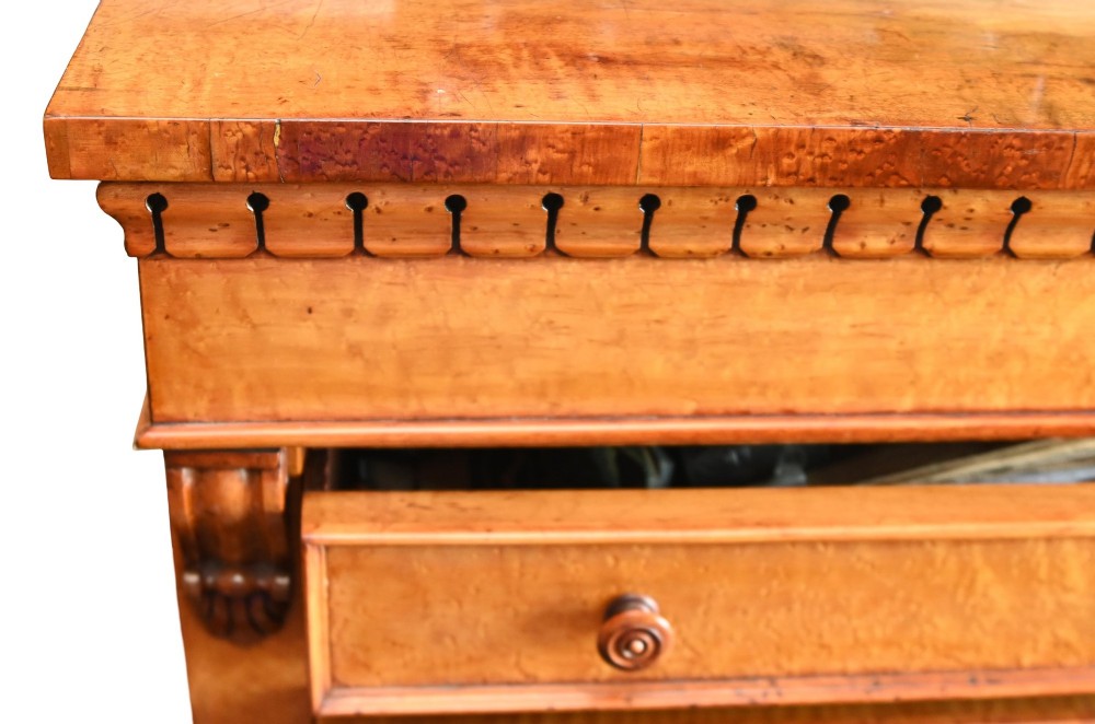 A tall Victorian birds eye maple Wellington chest featuring seven drawers with turned wooden knobs and a side locking flap. View VIII