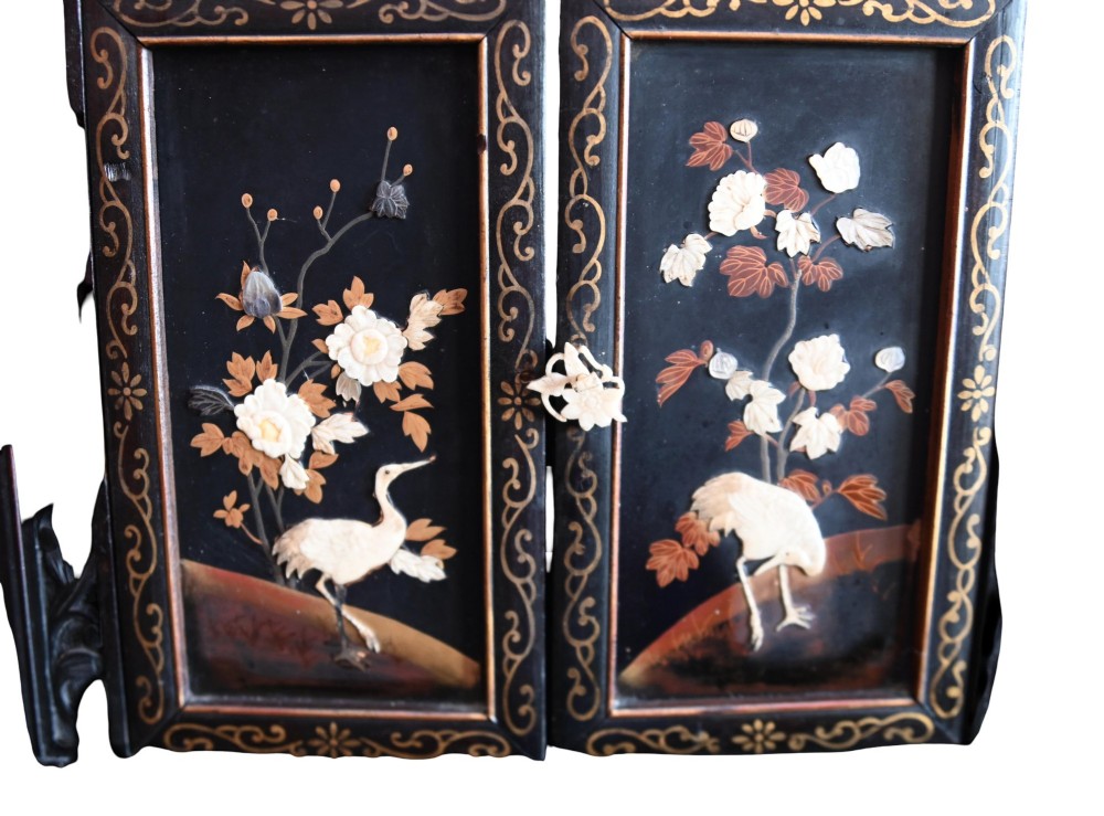 An antique ebonised Chinese display cabinet featuring asymmetrical shelves, pierced fretwork, and panels decorated with mother-of-pearl crane and botanical inlays. View IX