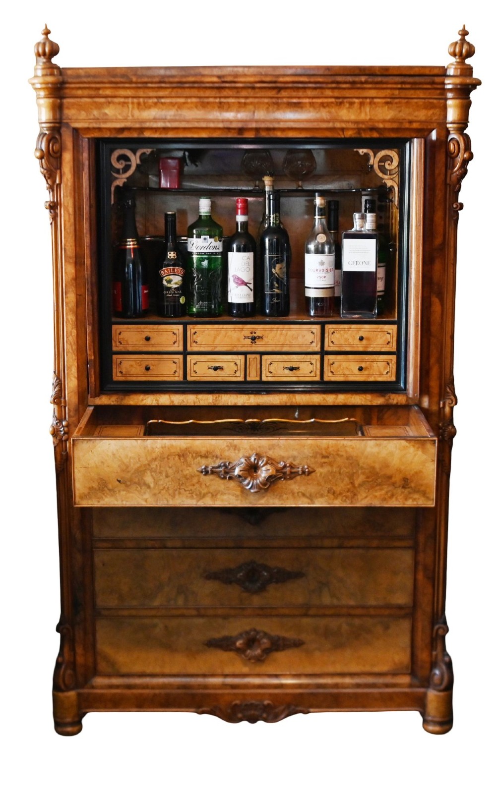 A tall 19th-century French Louis Philippe secretaire desk featuring figured birds-eye maple veneer, carved wooden handles, upper cabinet doors, and finials on top. View VII
