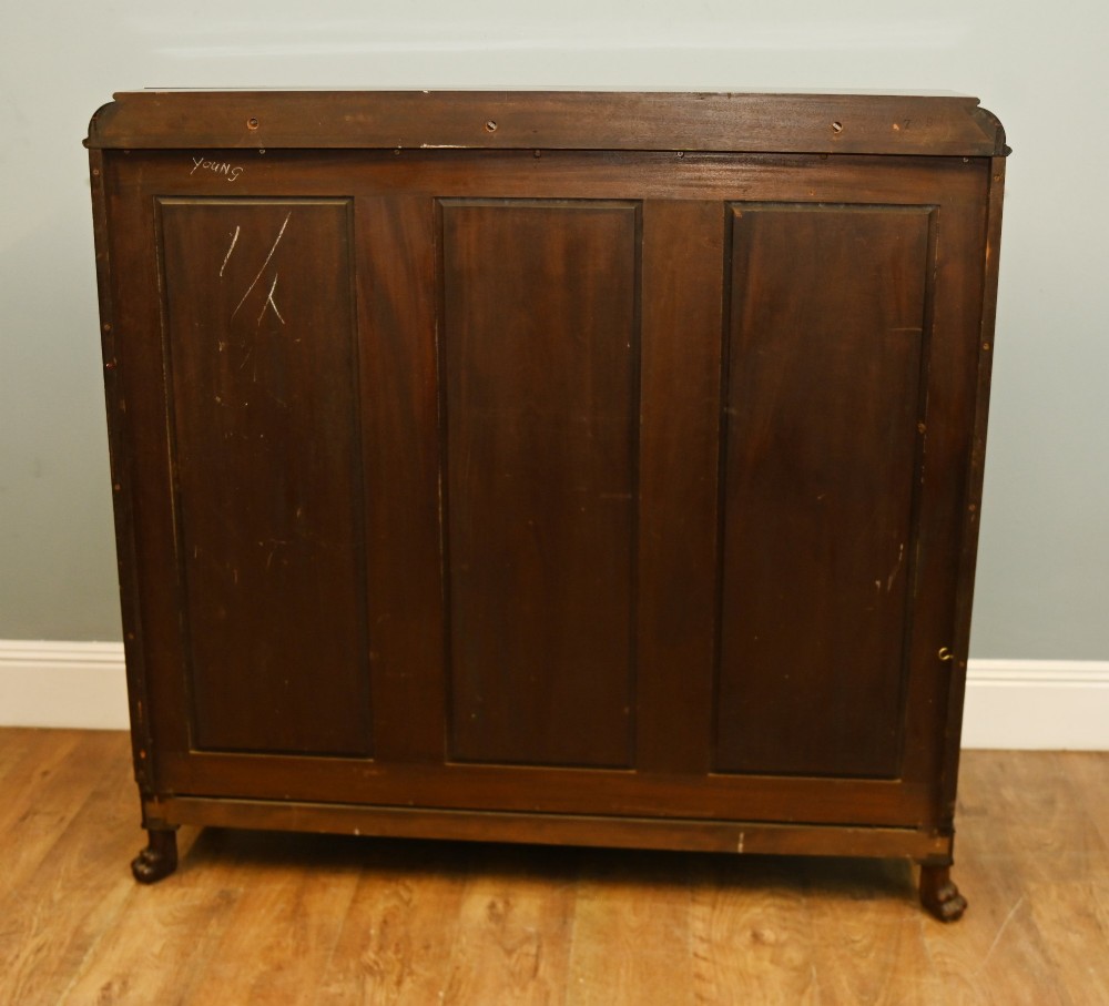 A Chippendale Revival mahogany display cabinet featuring three astragal glazed doors and carved ball and claw feet. View X