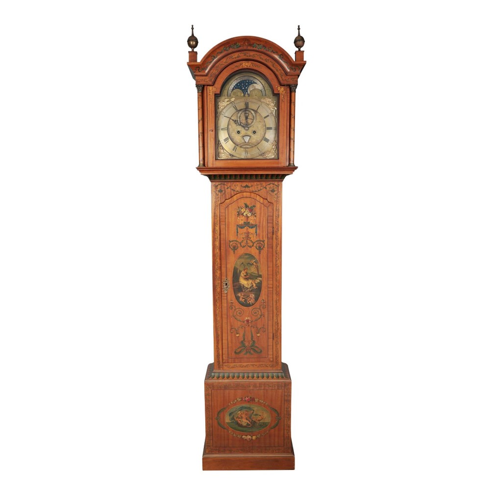 An antique Scottish painted satinwood longcase clock with an arched moonphase dial, brass finials, and neoclassical floral painted panels.
