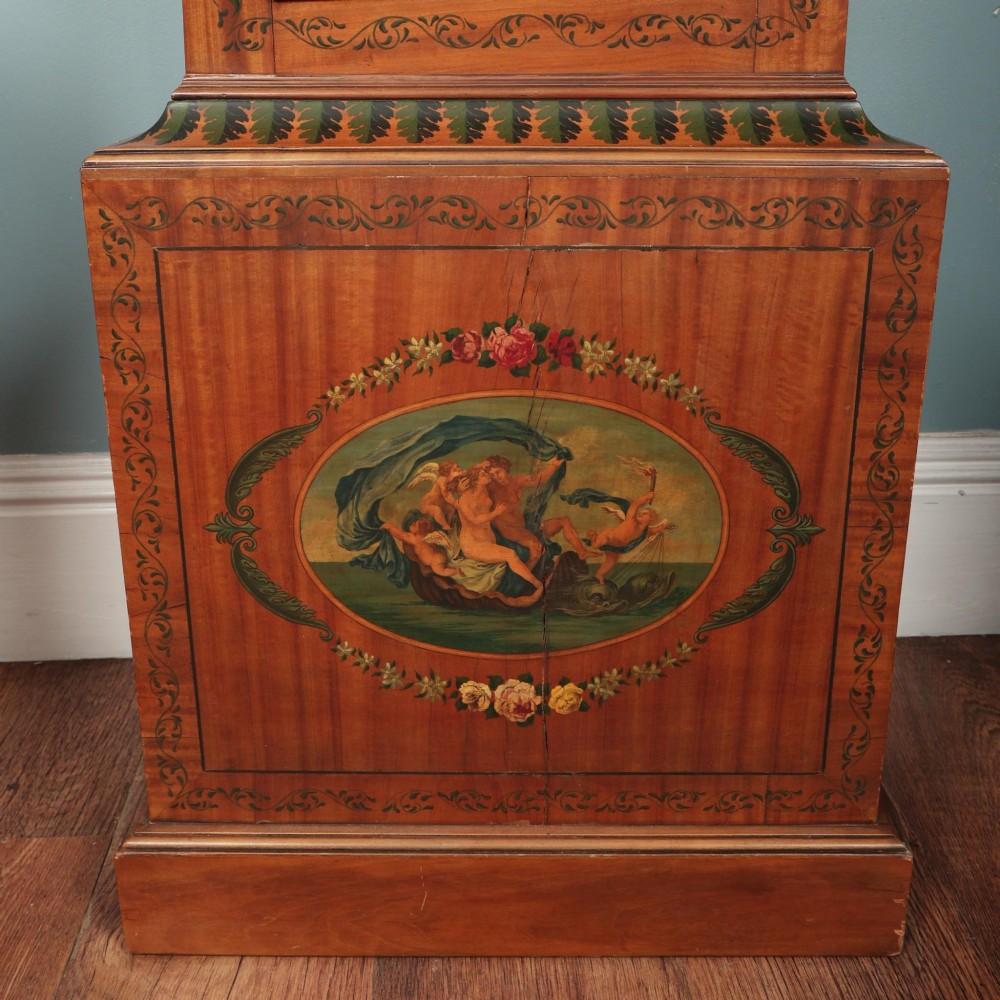 An antique Scottish painted satinwood longcase clock with an arched moonphase dial, brass finials, and neoclassical floral painted panels. View VII