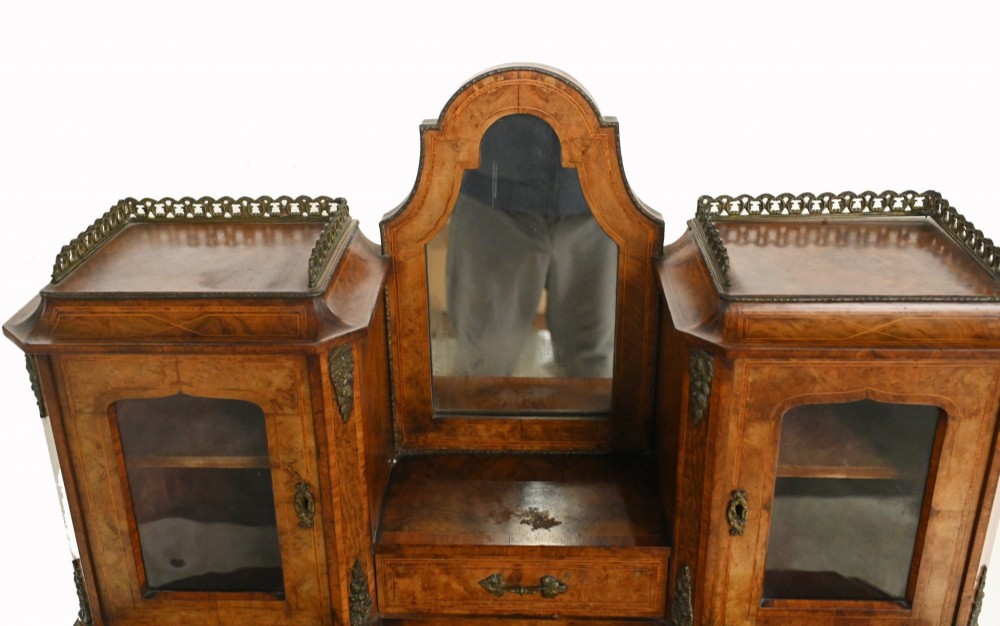 A 19th-century French walnut bonheur du jour desk featuring cabriole legs, a slant-front writing slope, and an upper superstructure with small glazed cabinets framing a central arched mirror. View VI