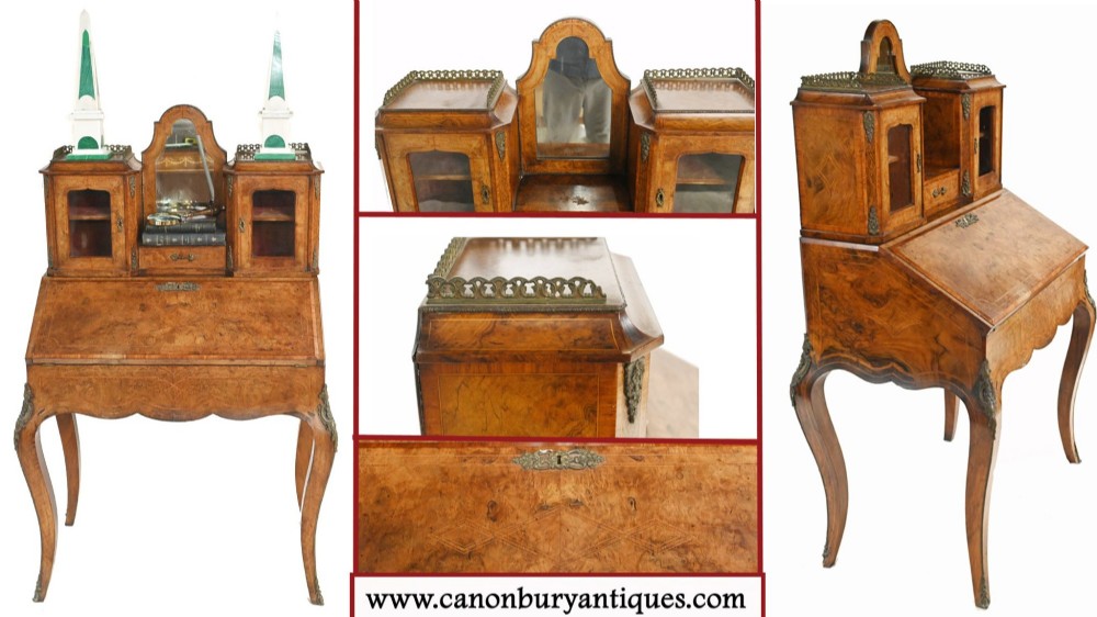 A 19th-century French walnut bonheur du jour desk featuring cabriole legs, a slant-front writing slope, and an upper superstructure with small glazed cabinets framing a central arched mirror. View VII
