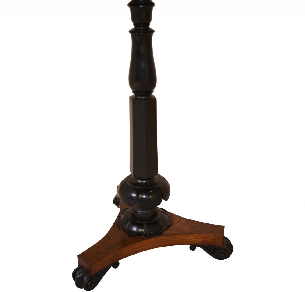 Victorian mahogany lectern desk featuring a sloped leather writing surface, turned ebonised pedestal, and triform base with scroll feet. View IV
