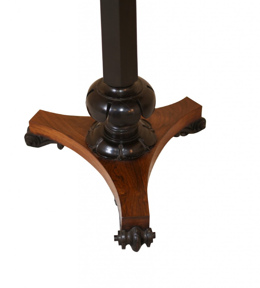 Victorian mahogany lectern desk featuring a sloped leather writing surface, turned ebonised pedestal, and triform base with scroll feet. View VII