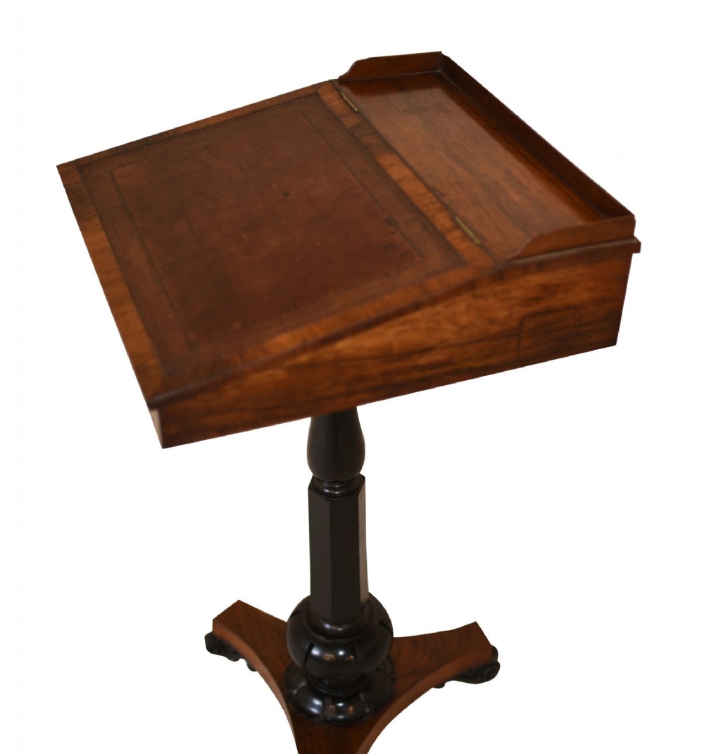 Victorian mahogany lectern desk featuring a sloped leather writing surface, turned ebonised pedestal, and triform base with scroll feet. View VIII