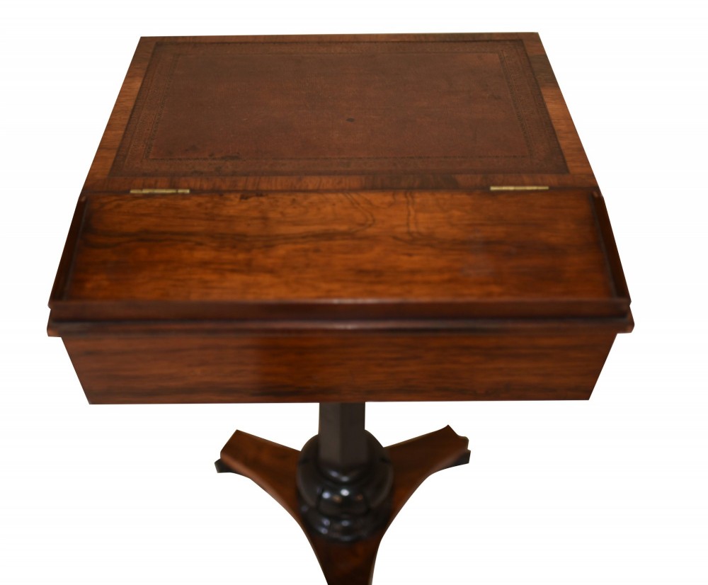 Victorian mahogany lectern desk featuring a sloped leather writing surface, turned ebonised pedestal, and triform base with scroll feet. View XIII