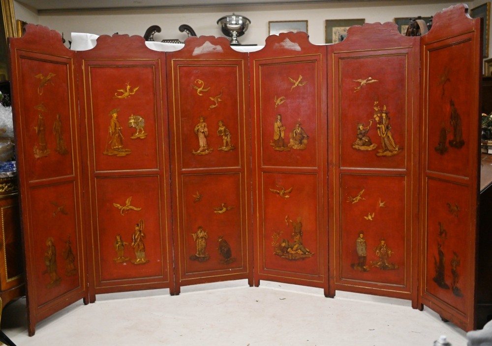 A six-panel folding room divider featuring deep red surfaces adorned with gilt rococo scrollwork frames surrounding painted classical figures, cherubs, and urns. View VII