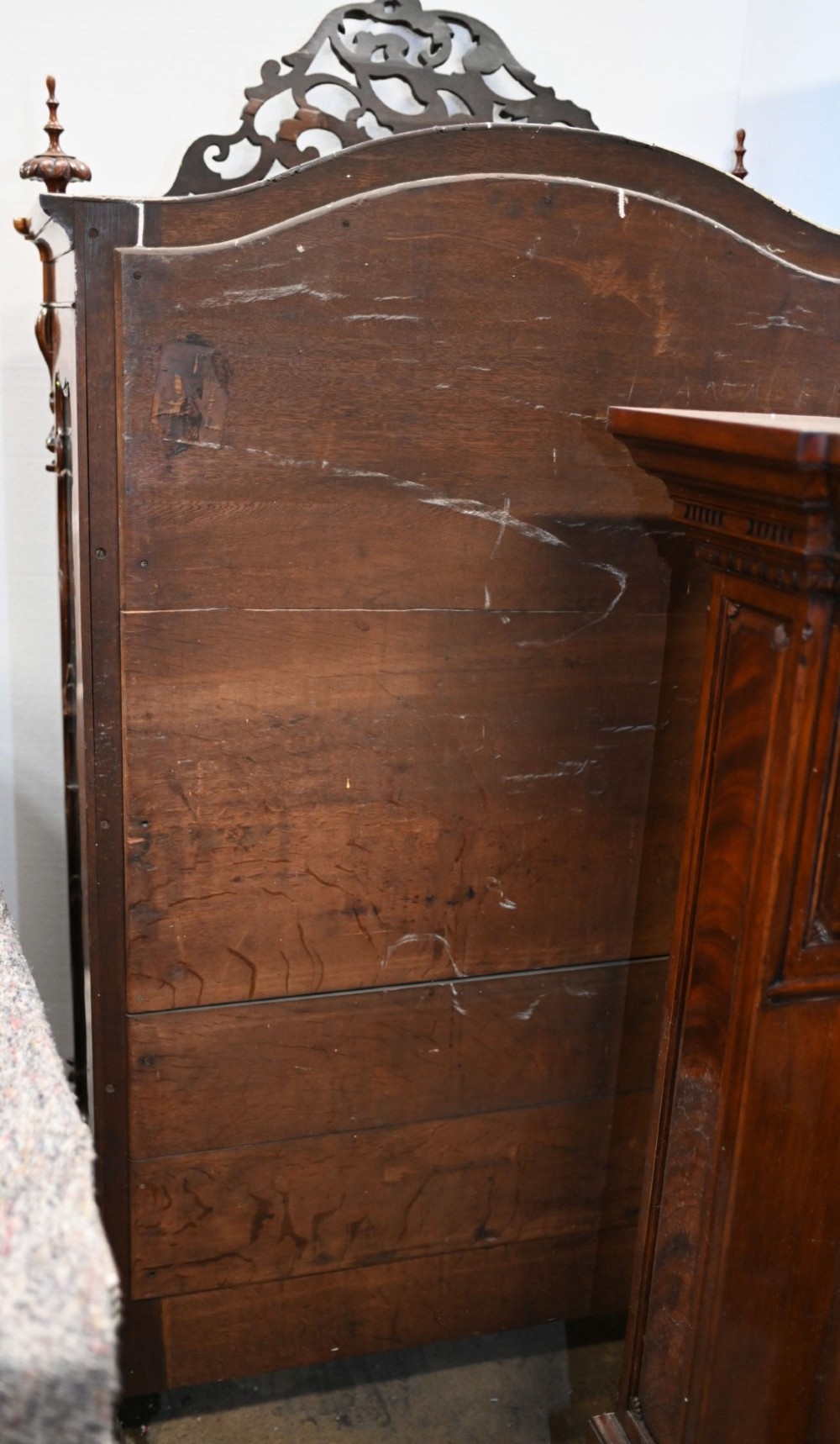 An antique French mahogany glazed vitrine cabinet featuring ornate cresting carvings, glass shelves, and carved cabriole legs. View XI