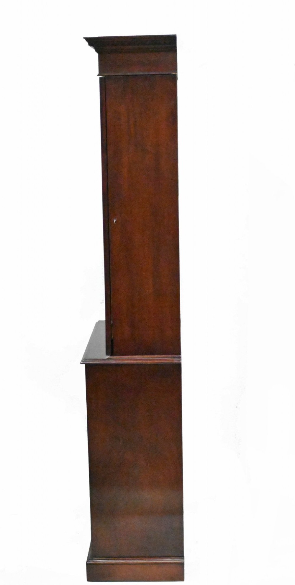 A tall Georgian mahogany glazed bookcase featuring an astragal glass upper cabinet set above four graduated drawers with brass pull knobs. View VII