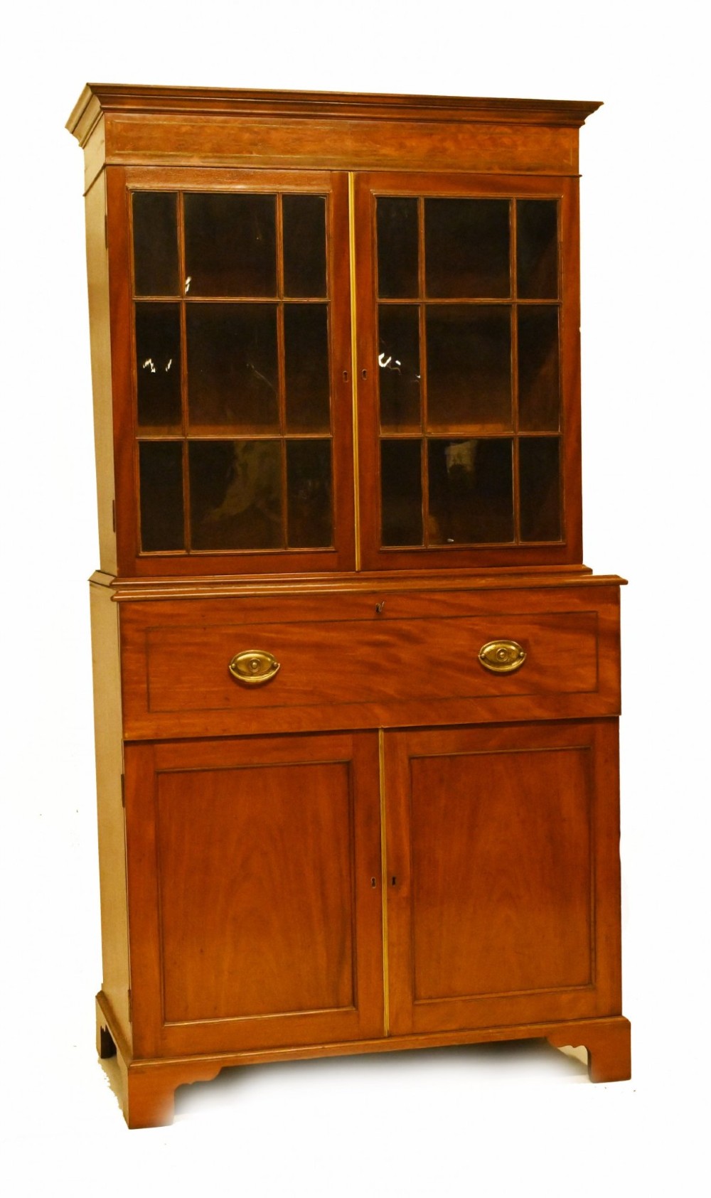 A Georgian mahogany secretaire bookcase featuring a glazed upper cabinet, a pull-out secretaire drawer with brass oval handles, and lower panelled doors. View VIII