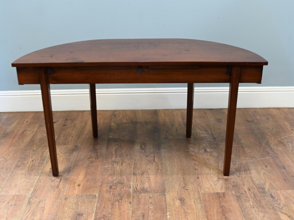 A pair of antique Georgian mahogany demi-lune console tables with semi-circular tops and straight tapered legs. View VIII