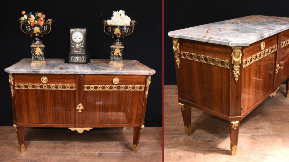 A French Empire style rosewood commode with a grey veined marble top, ornamental gilt bronze mounts, and square tapered legs with brass feet. View IX