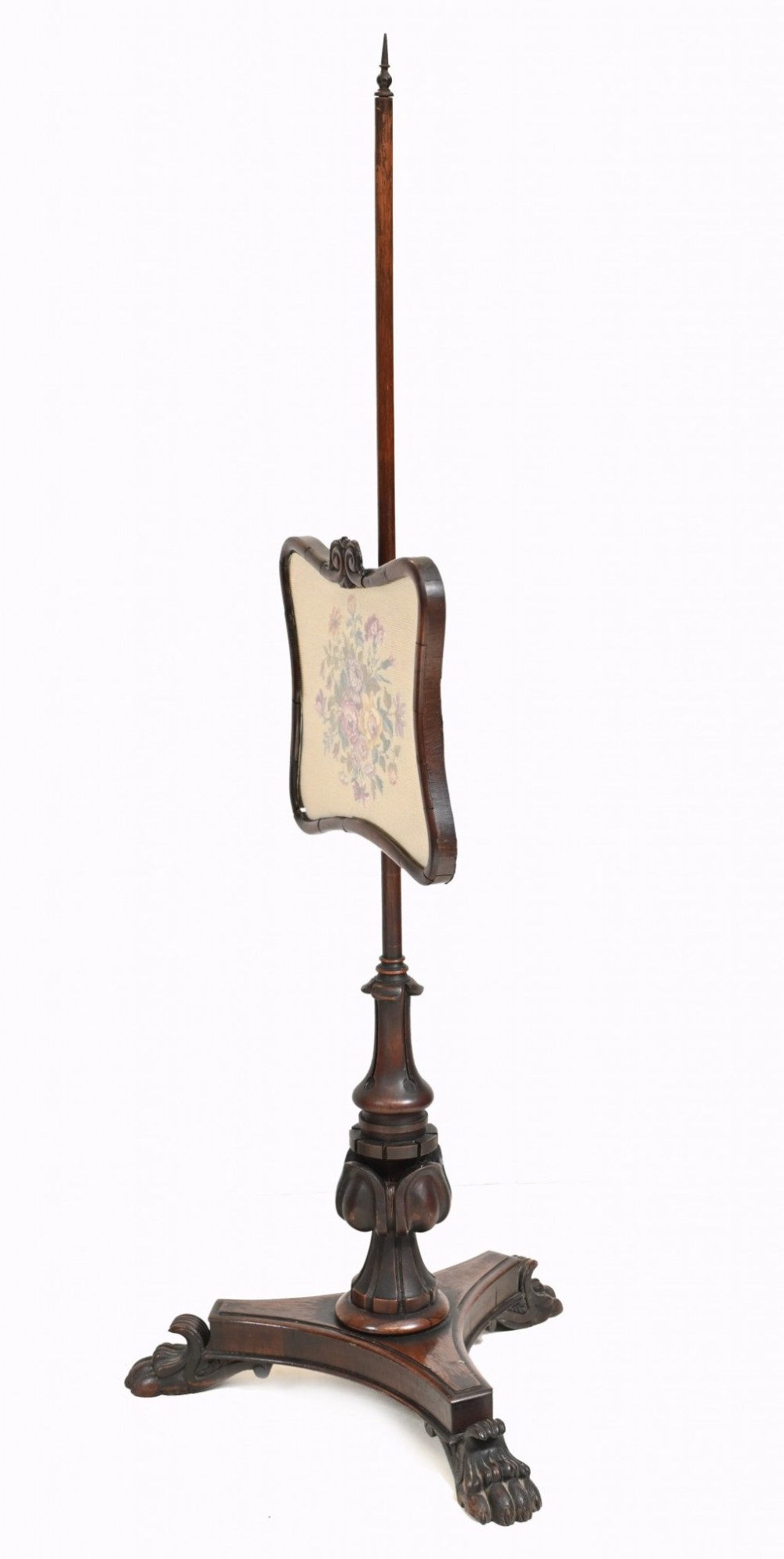 A pair of 19th-century Regency pole screens crafted from dark rosewood with carved tripod bases and adjustable rectangular needlepoint tapestry panels. View V