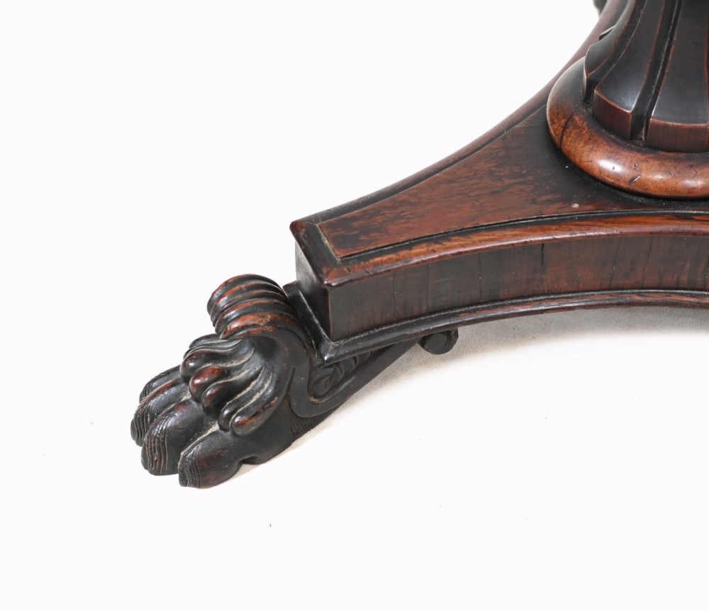 A pair of 19th-century Regency pole screens crafted from dark rosewood with carved tripod bases and adjustable rectangular needlepoint tapestry panels. View VIII