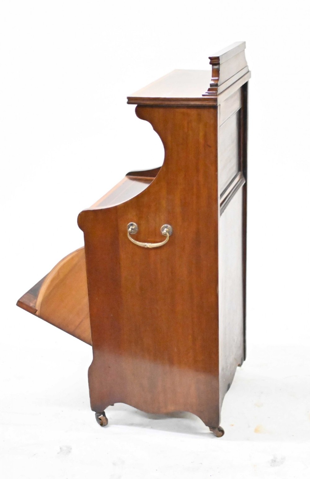 A late Victorian mahogany coal purdonium cabinet featuring satinwood marquetry inlay, a brass handle on the drop-front door, an upper shelf, and a small mirrored back panel. View IV