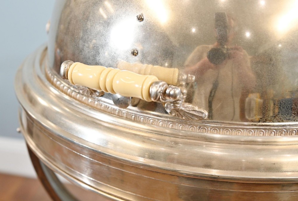 A Victorian silver-plated carvery trolley with a domed retractable cover set atop a carved mahogany pedestal base with swivel castors. View II