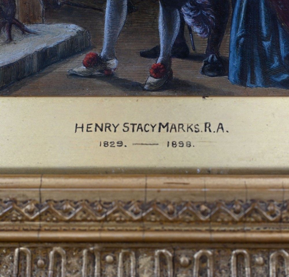 A 19th-century Victorian oil painting depicting figures in historical dress examining a portrait by candlelight, set within a heavily carved gold gilt frame. View IX