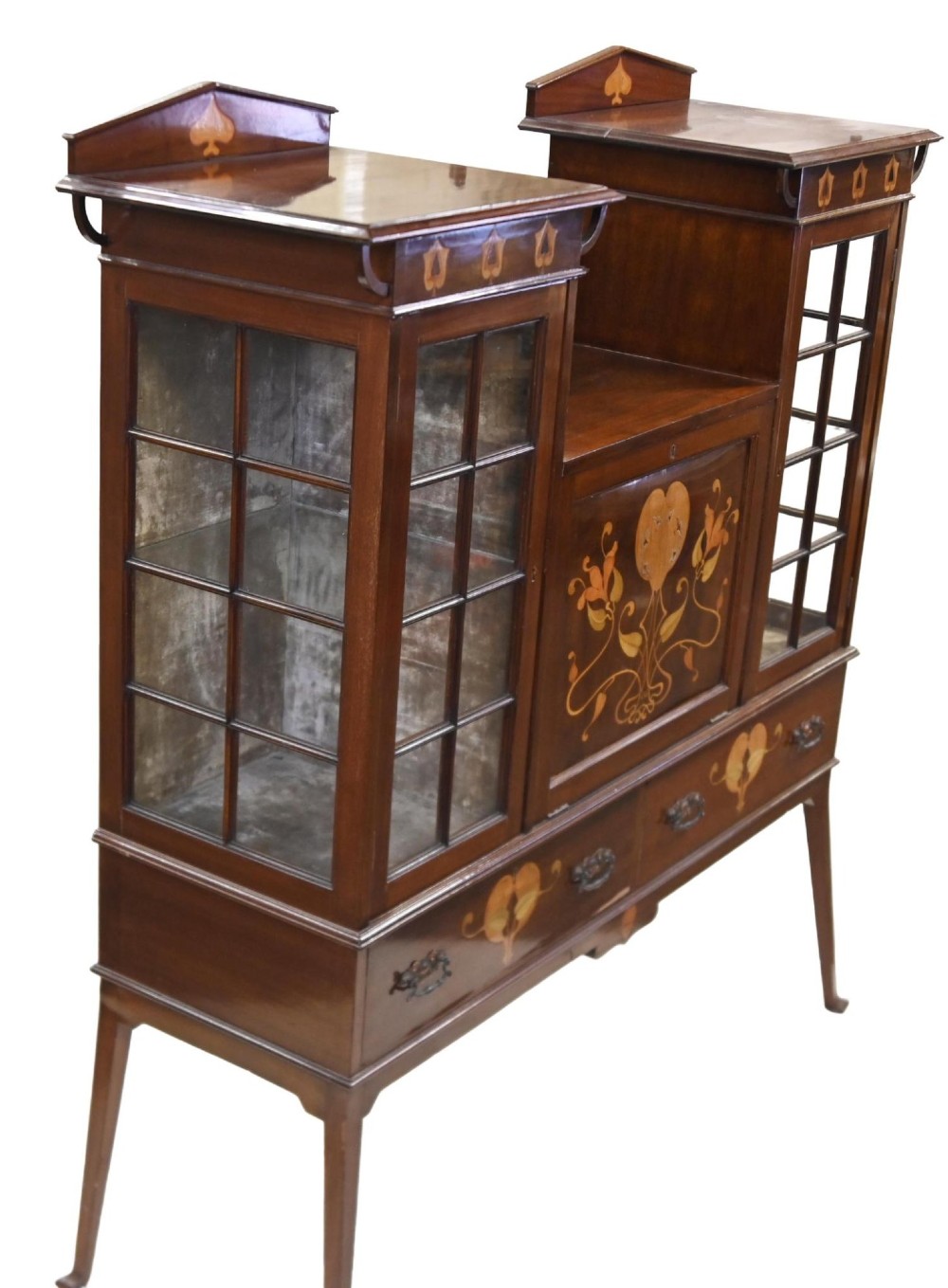 An Edwardian Art Nouveau dark mahogany drinks cabinet featuring stylised botanical marquetry inlays, twin glazed side doors, two lower drawers, and slender splayed legs. View II