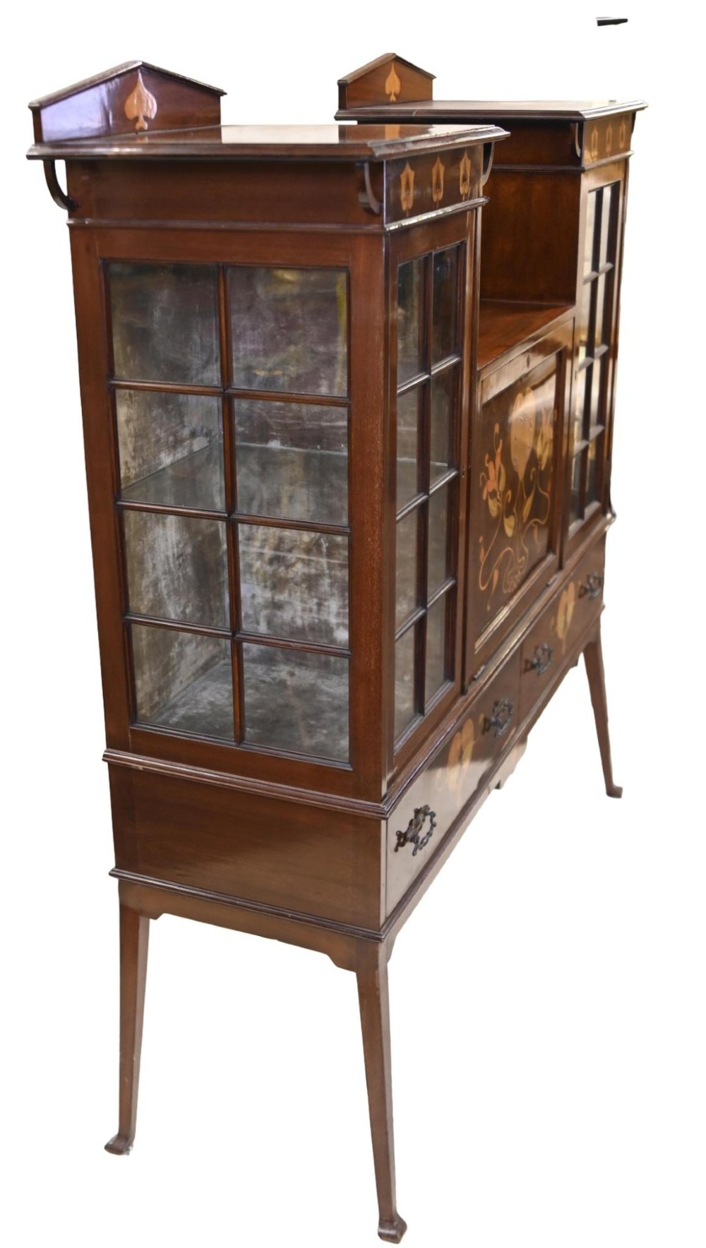 An Edwardian Art Nouveau dark mahogany drinks cabinet featuring stylised botanical marquetry inlays, twin glazed side doors, two lower drawers, and slender splayed legs. View VI