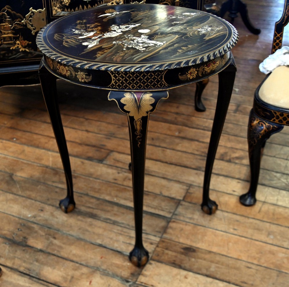 A circular black lacquered side table featuring gilded Chinoiserie landscape motifs, bone inlay details, carved cabriole legs, and ball and claw feet. View III