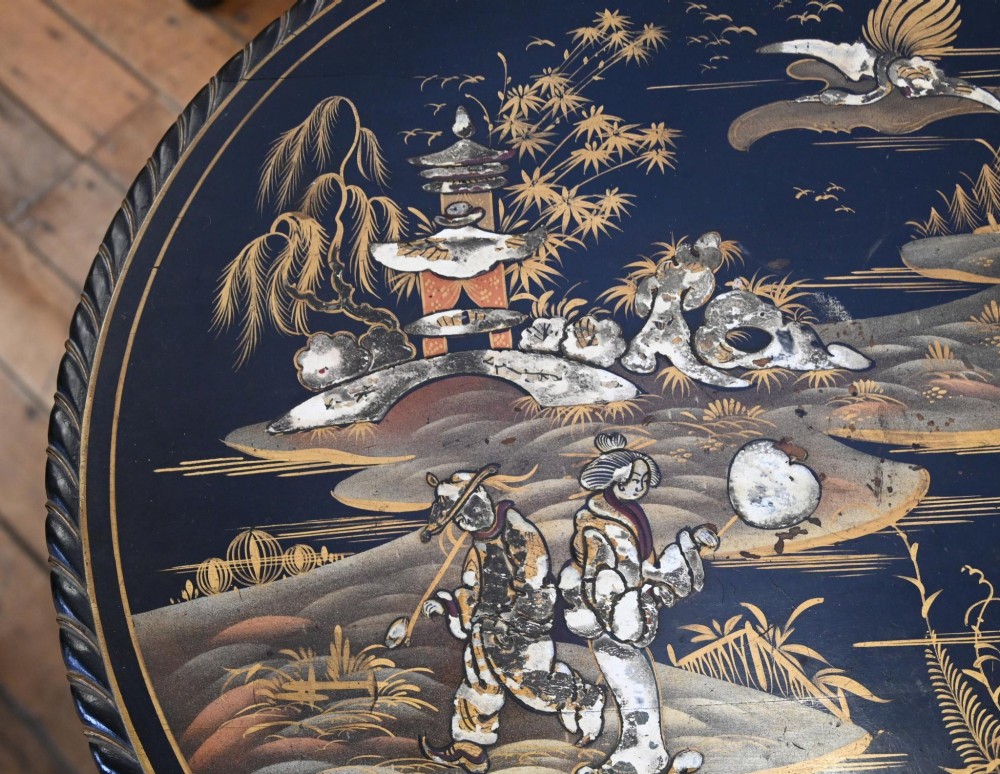 A circular black lacquered side table featuring gilded Chinoiserie landscape motifs, bone inlay details, carved cabriole legs, and ball and claw feet. View IV