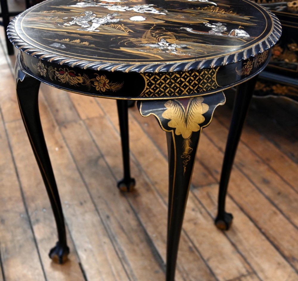 A circular black lacquered side table featuring gilded Chinoiserie landscape motifs, bone inlay details, carved cabriole legs, and ball and claw feet. View VII