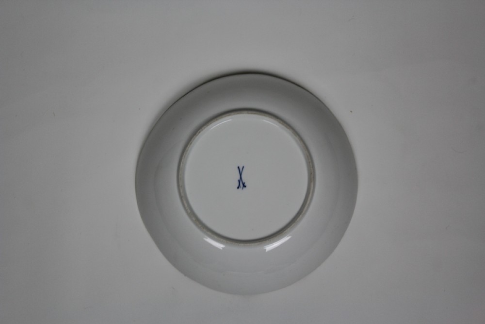 A circular white porcelain bowl featuring hand-painted bird and insect motifs with a basketweave embossed border and gilded rim. View II