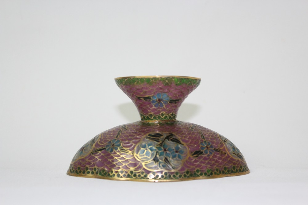 A footed plique-a-jour enamel bowl featuring a pink geometric background with blue floral medallions and gilt metal rim. View III