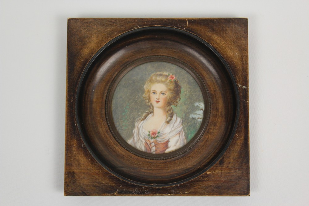 A pair of antique square dark wood framed portrait miniatures depicting two women dressed in historical attire. View III
