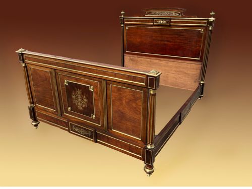 A Mahogany and Brass French Empire Style Bed.