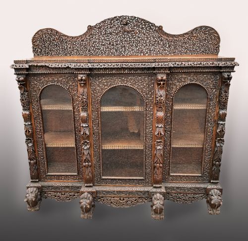 A Heavily Carved Burmese Glazed Breakfront Library Bookcase