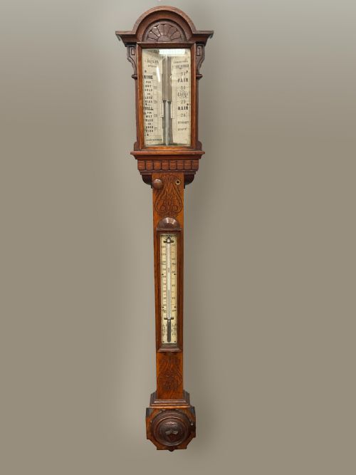 A 19th Century Birmingham Oak Stick Barometer and Thermometer.