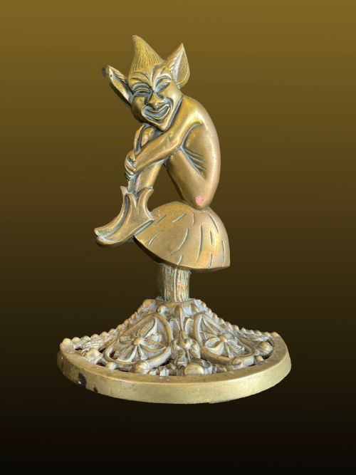 A Brass Weighted Pixie Door Stop