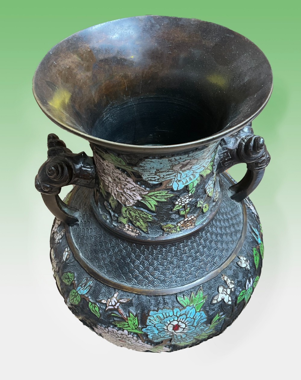 A late 19th-century Japanese bronze baluster vase featuring colourful enamel floral decorations and beast head loop handles. View IV