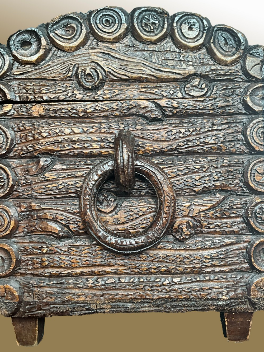 A dome-topped carved wooden box featuring a faux log bark texture with a central olive green velvet band. View II