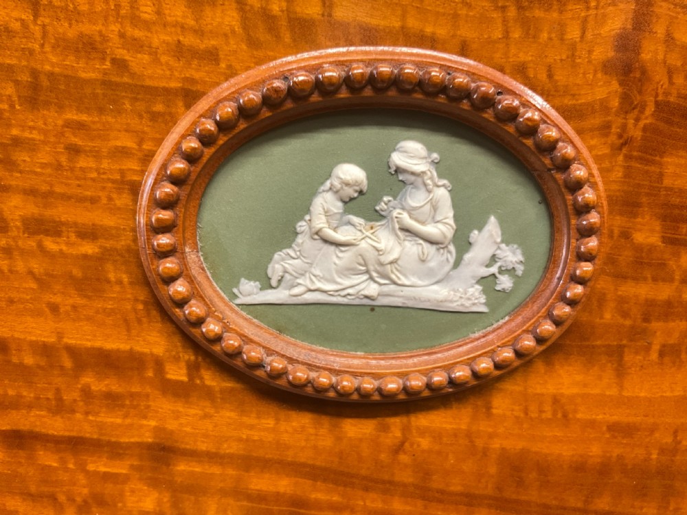 An exhibition quality satin wood and porcelain mounted cabinet with gold key. View VII