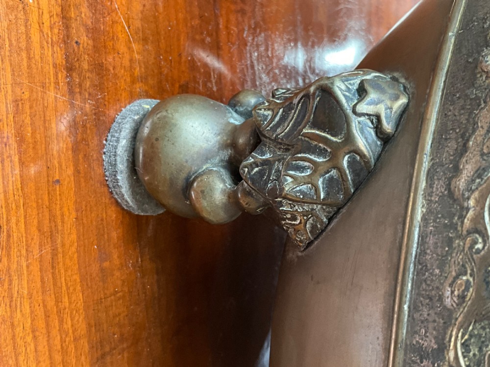 A pair of patinated bronze Oriental jardinieres featuring relief dragon carvings, scalloped rims, and tripod mask feet. View VII