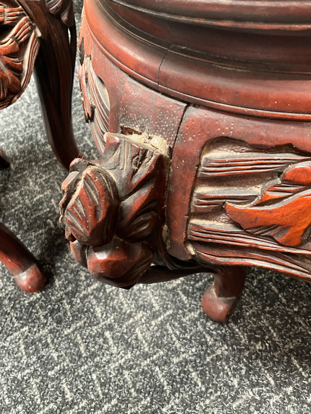 A pair of large round blue and white Japanese porcelain jardinieres decorated with avian motifs resting on intricately carved hardwood stands. View VII