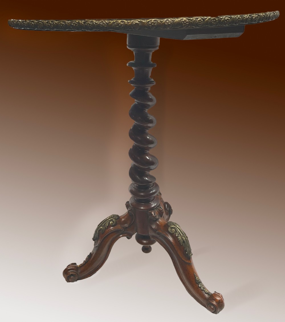 A Victorian circular walnut wine table featuring floral marquetry wood inlay on the top, a spiral-carved central column, and a tripod base with brass accents. View III