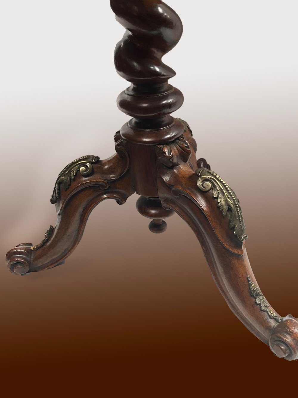 A Victorian circular walnut wine table featuring floral marquetry wood inlay on the top, a spiral-carved central column, and a tripod base with brass accents. View IV