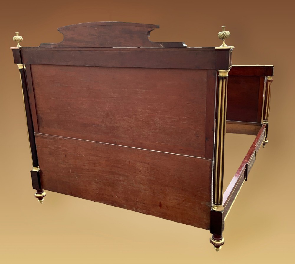 A mahogany and brass French Empire style bed. View II